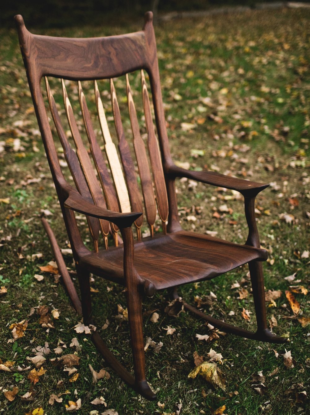 A replica of the maloof rocker made from a beautiful slab of wood.