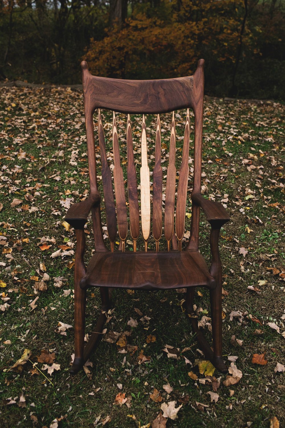 A replica of the maloof rocker made from a beautiful slab of wood.