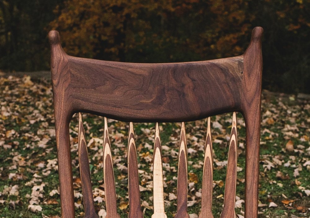 A replica of the maloof rocker made from a beautiful slab of wood.